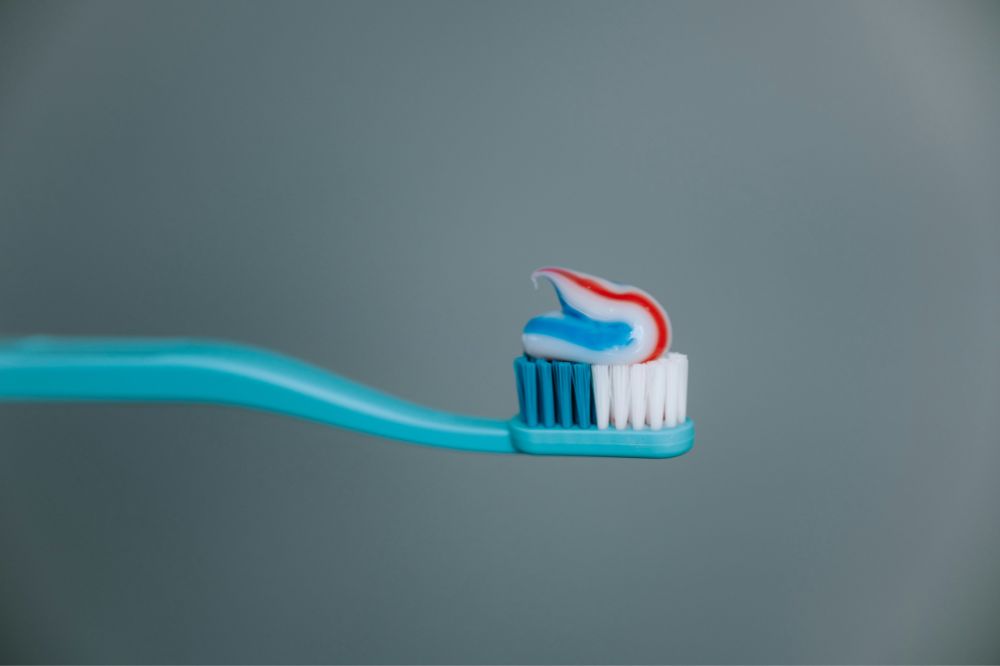 Toothbrush with fluoride toothpaste