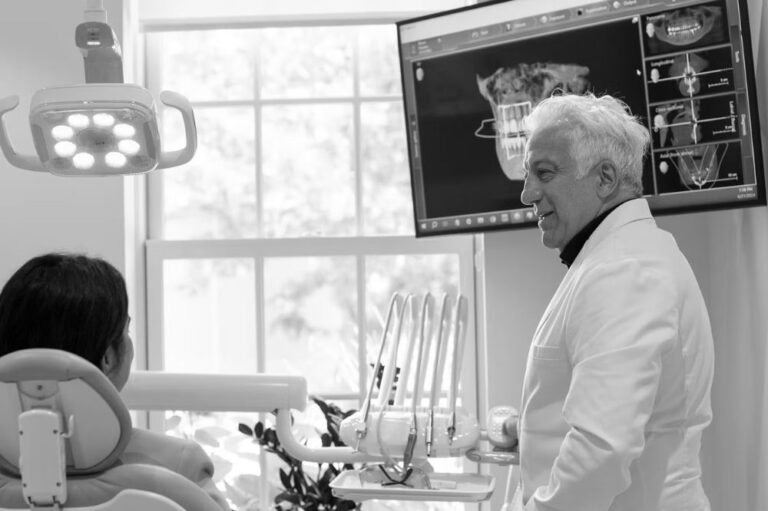 Do Gerry talking to a woman in a dentist chair