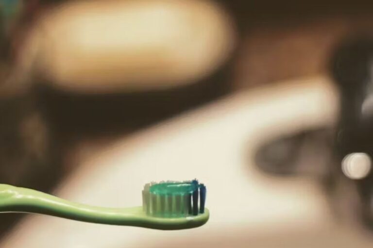 Green tooth brush with toothpaste