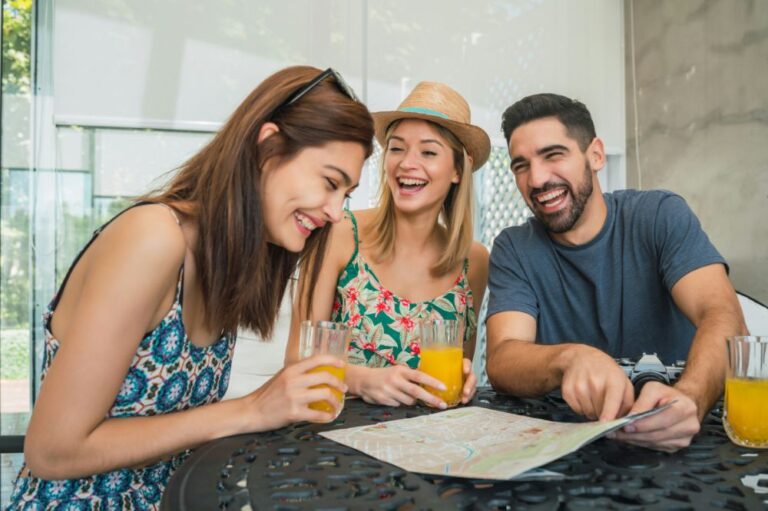 2 women and 1 man laughing