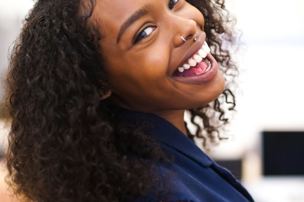 Woman smiling in blue shirt